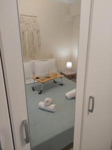 a view of a room with a table and a mirror at Alexandra by the Sea in Nea Peramos +32 photos