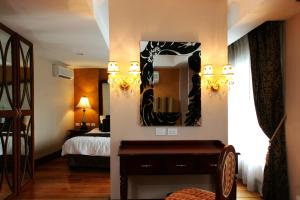Voodi või voodid majutusasutuse Hotel Celeste Makati toas