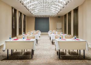 a conference room with tables and chairs and a chalkboard at Levni Premium Hotel Istanbul Old City in Istanbul +26 photos