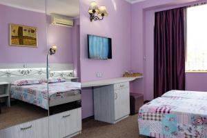 Postel nebo postele na pokoji v ubytování Kirios Hotel