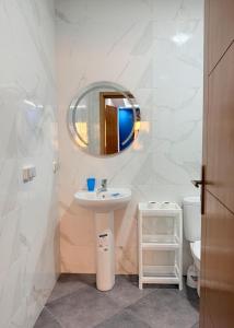 a bathroom with a sink and a mirror at Playa Surf House in Tamraght Ouzdar +212 photos