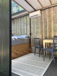Postel nebo postele na pokoji v ubytování Tree House