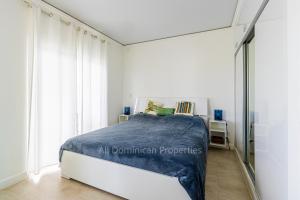 a bedroom with a bed and a mirror at Sosua private apartments and studios! in Laguna del Higüero +19 photos