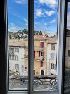 a view from a window of buildings at Apartment Vallauris in Vallauris