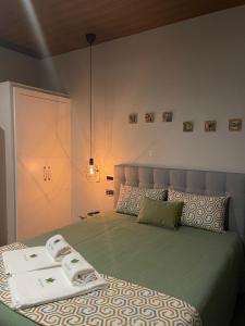 a bedroom with a bed with two towels on it at Casa Videira in Gouveia +72 photos