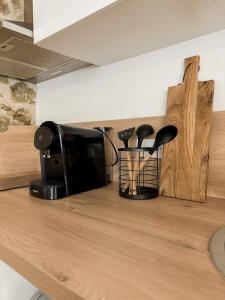 a counter top with a coffee maker and a coffee pot at Apartment Vallauris in Vallauris