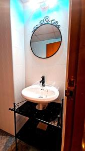 a bathroom with a sink and a mirror on the wall at River View Active 6 in Bangkok