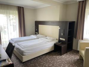Katil atau katil-katil dalam bilik di Hotel Ochsen Stuttgart