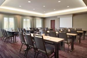 a conference room with tables and chairs and a whiteboard at Courtyard by Marriott Dayton Beavercreek in Beavercreek +71 photos