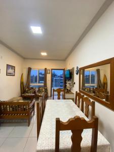 Μια τηλεόραση ή/και κέντρο ψυχαγωγίας στο J-bay House - Capão da Canoa +18 φωτογραφίες