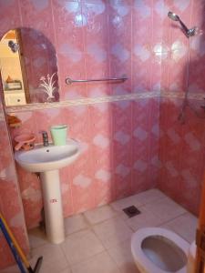 a bathroom with a sink and a toilet at Billa appart in Midelt