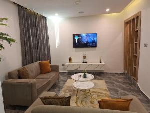 NPJ Luxury Serviced Apartments的电视和/或娱乐中心