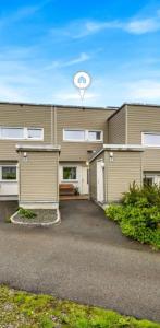 a building with a clock on the top of it at Apartment near Oslo, Drammen, and a lake in Lier