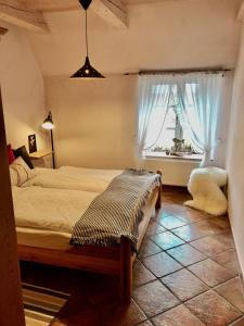 Postel nebo postele na pokoji v ubytování Haubarg alte Strandvogtei