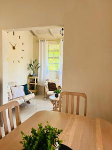 a living room with a table and a couch at Entire Home - West Coast Barbados in Saint Peter