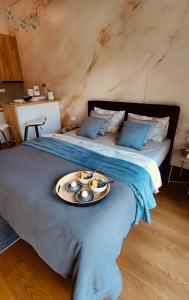 a bed with a tray of food on top of it at Residence in Belgrade