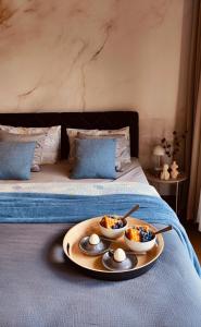 a tray with two eggs on top of a bed at Residence in Belgrade