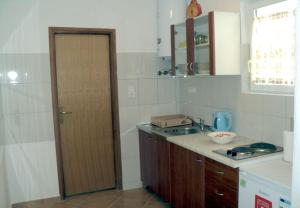 Kuchyň nebo kuchyňský kout v ubytování Apartments Niko
