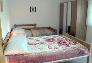 Postel nebo postele na pokoji v ubytování Apartments Niko