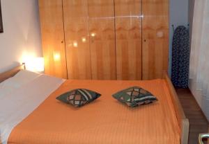 Postel nebo postele na pokoji v ubytování Apartments Niko