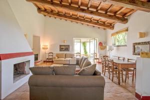 a living room with a couch and a fireplace at Vigna Luisa Resort - Near Rome in Genzano di Roma