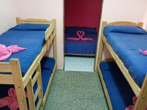 En eller flere senge i et værelse på Palmeras Del Tuyu