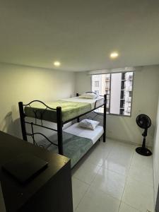 Postel nebo postele na pokoji v ubytování Apartamento de descanso Peñalisa Ricaurte