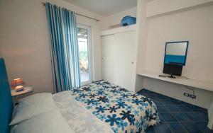Cama o camas de una habitación en Magico Appartamenti Scafa - Marina Capo d'Orlando