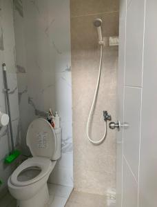 a bathroom with a toilet and a shower at entire house for you in Cikeas