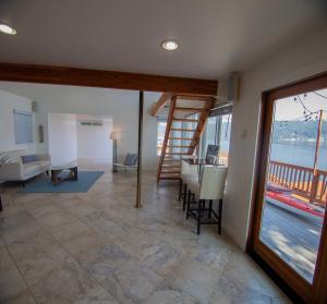 a living room with a view of the water at Lakefront with private beach in Redmond