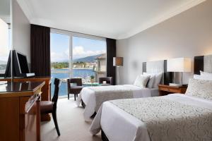 Postel nebo postele na pokoji v ubytování Hotel President Wilson, a Luxury Collection Hotel, Geneva