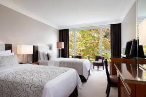 Postel nebo postele na pokoji v ubytování Hotel President Wilson, a Luxury Collection Hotel, Geneva