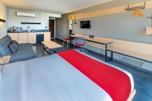 A television and/or entertainment centre at City Express by Marriott Tuxpan