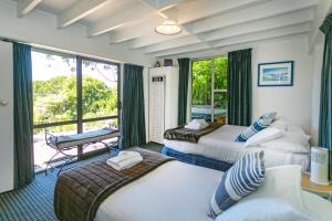 Ένα ή περισσότερα κρεβάτια σε δωμάτιο στο Coromandel Apartments