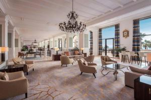a large living room with a chandelier at The Westin Dragonara Resort, Malta in St. Julianʼs
