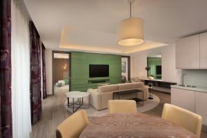 a living room with a couch and a table at The Westin Dragonara Resort, Malta in St. Julianʼs