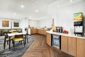 a restaurant with a counter and a table and chairs at Fairfield Inn Scranton in Scranton