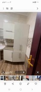 a picture of a kitchen with two white cabinets at شقه للايجار المفروش بالشيخ زايد شباب وعائلات in Sheikh Zayed