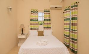 Giường trong phòng chung tại La Gentillesse Apartments - Modern, Comfortable and Quiet