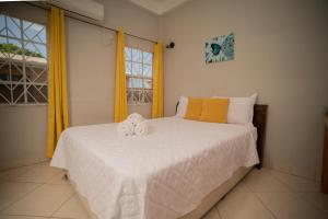 Giường trong phòng chung tại La Gentillesse Apartments - Modern, Comfortable and Quiet