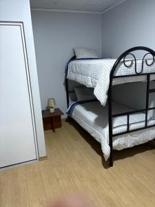 a bedroom with two bunk beds and a mirror at Villa MAS - Condominio Hacienda II in Pachacamac +20 photos