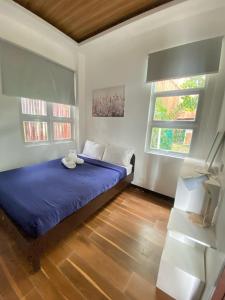 Postel nebo postele na pokoji v ubytování Casa Loubel Beach Resort