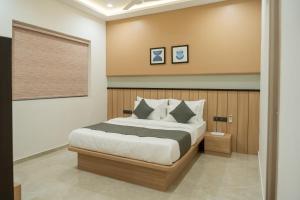 Postel nebo postele na pokoji v ubytování RAMAINn HOTEL