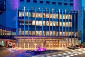 a large building with purple lights in front of it at Aloft Kuala Lumpur Sentral in Kuala Lumpur