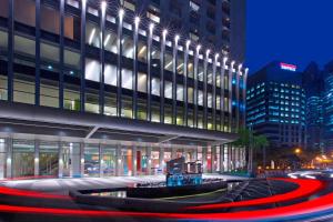 a building with a red circle in front of it at Aloft Kuala Lumpur Sentral in Kuala Lumpur