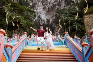 a man and a woman walking up the stairs of a bridge at Aloft Kuala Lumpur Sentral in Kuala Lumpur