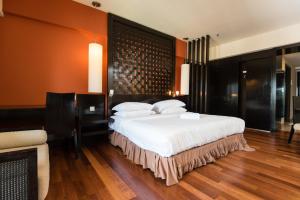 Postel nebo postele na pokoji v ubytování New Town Resort Suites at Pyramid Tower + 5 fotografií