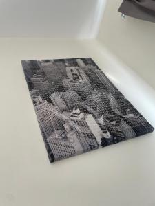 a black and white picture on a white table at Matinii Premier in Ban Talat Rangsit