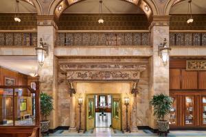 a lobby of a building with a sign that reads firststand shuttle at The Brown Palace Hotel and Spa, Autograph Collection in Denver