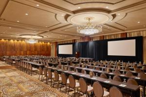a large room with rows of tables and chairs at The Brown Palace Hotel and Spa, Autograph Collection in Denver